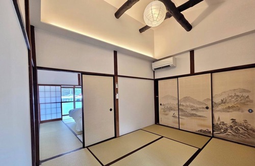 Hakone House | A vacation rental featuring a terrace, garden, and sauna—the entire house is yours! With Mt. Daimonji right before your eyes, take some time to relax in the spacious bus sauna.