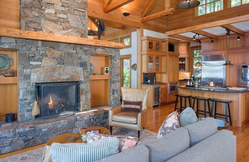 Orcas House | Magnificent waterfront home where sustainability meets luxury. Five private wooded acres, 400ft of rocky bluff shoreline, Chef's Kitchen, Stone Fireplaces, Heated Tile Floors & Unforgettable Sunsets over Wasp Passage. Your perfect PNW escape awaits.
