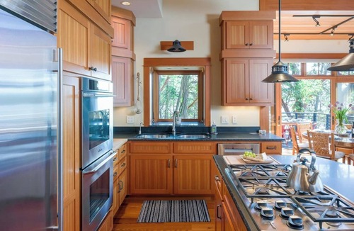 Orcas House | Magnificent waterfront home where sustainability meets luxury. Five private wooded acres, 400ft of rocky bluff shoreline, Chef's Kitchen, Stone Fireplaces, Heated Tile Floors & Unforgettable Sunsets over Wasp Passage. Your perfect PNW escape awaits.