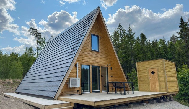A Frame cottage surrounded by a forest, incl sauna in Kallinge