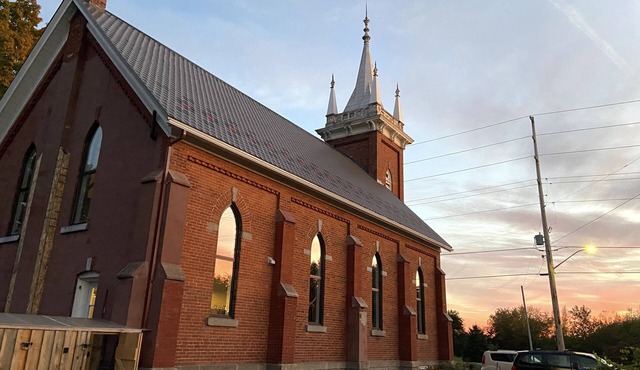 Country church converted into comfy, elegant escape — outdoor entertainment area
