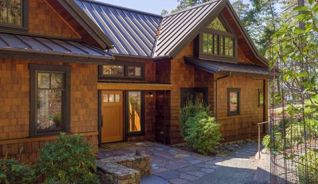 Magnificent waterfront home where sustainability meets luxury. Five private wooded acres, 400ft of rocky bluff shoreline, Chef's Kitchen, Stone Fireplaces, Heated Tile Floors & Unforgettable Sunsets over Wasp Passage. Your perfect PNW escape awaits.