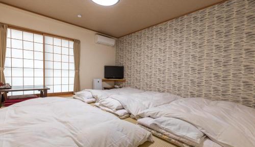 Quadruple Room with Shared Bathroom
